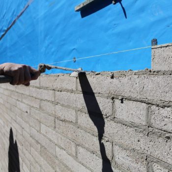 Photo of a Bricklayer working on a block fence in Ascot, Brisbane